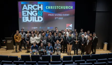 : Participants gather on stage at the conclusion of the 2026 BRANZ ArchEngBuild Challenge. 