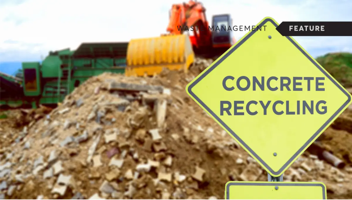 Photograph showing a construction rubble site with machinery in the background and a sign reading ‘Concrete Recycling’ in the foreground