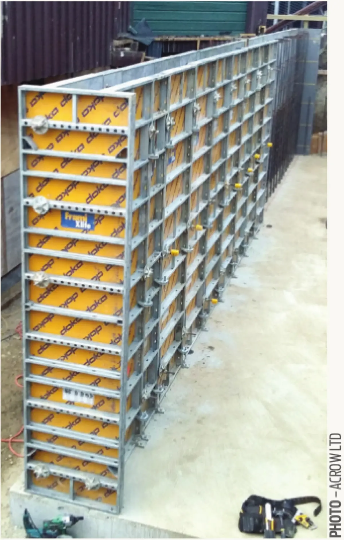 Photograph showing a tall wall formwork system set up on a concrete slab