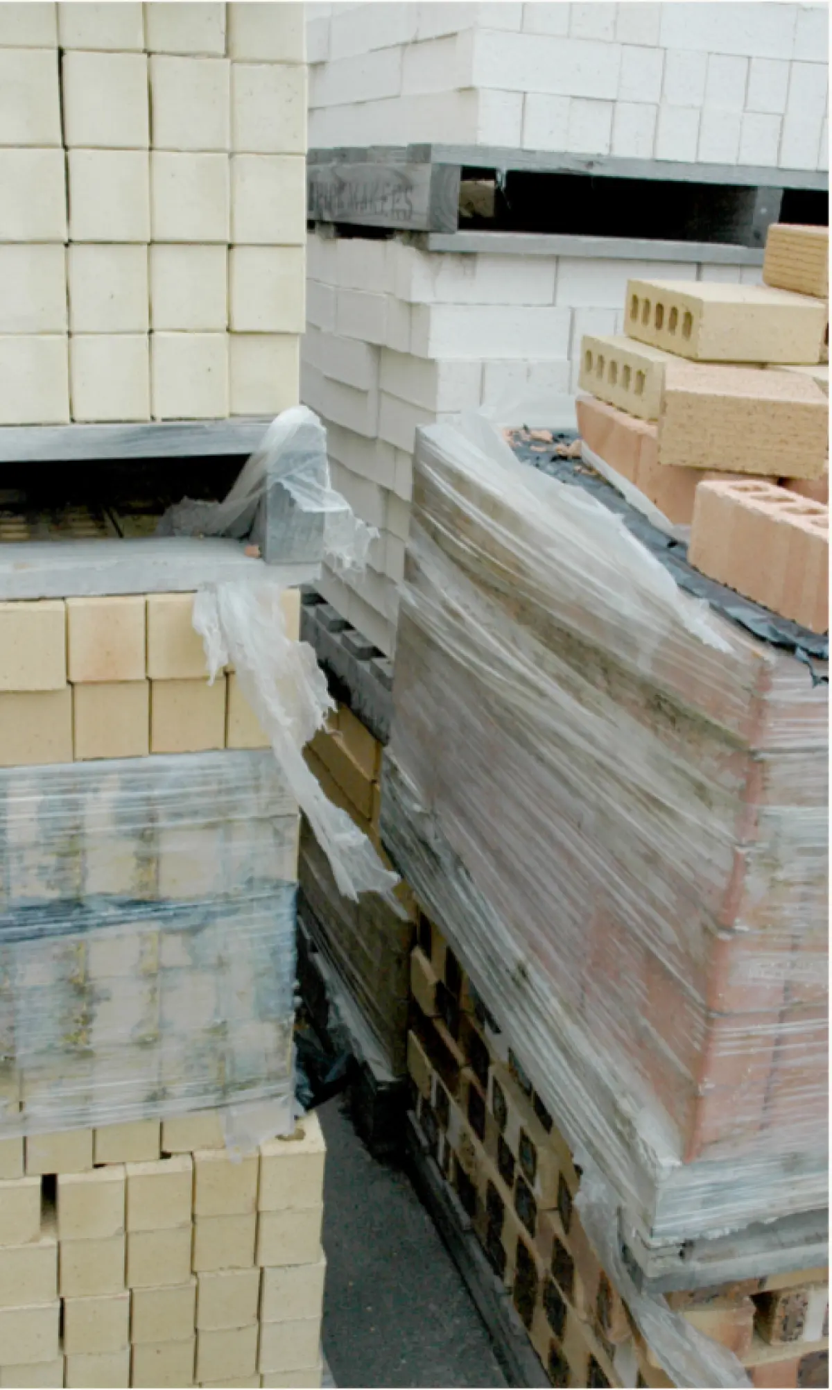 an image of bricks on pallets wrapped in plastic