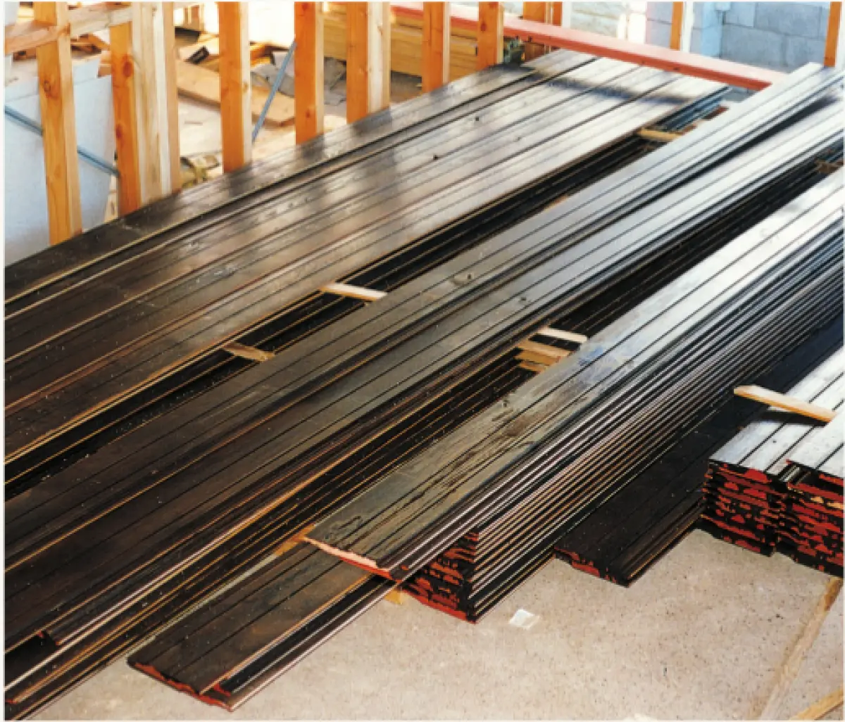 an image of prefinished weatherboards protected in covered storage 
