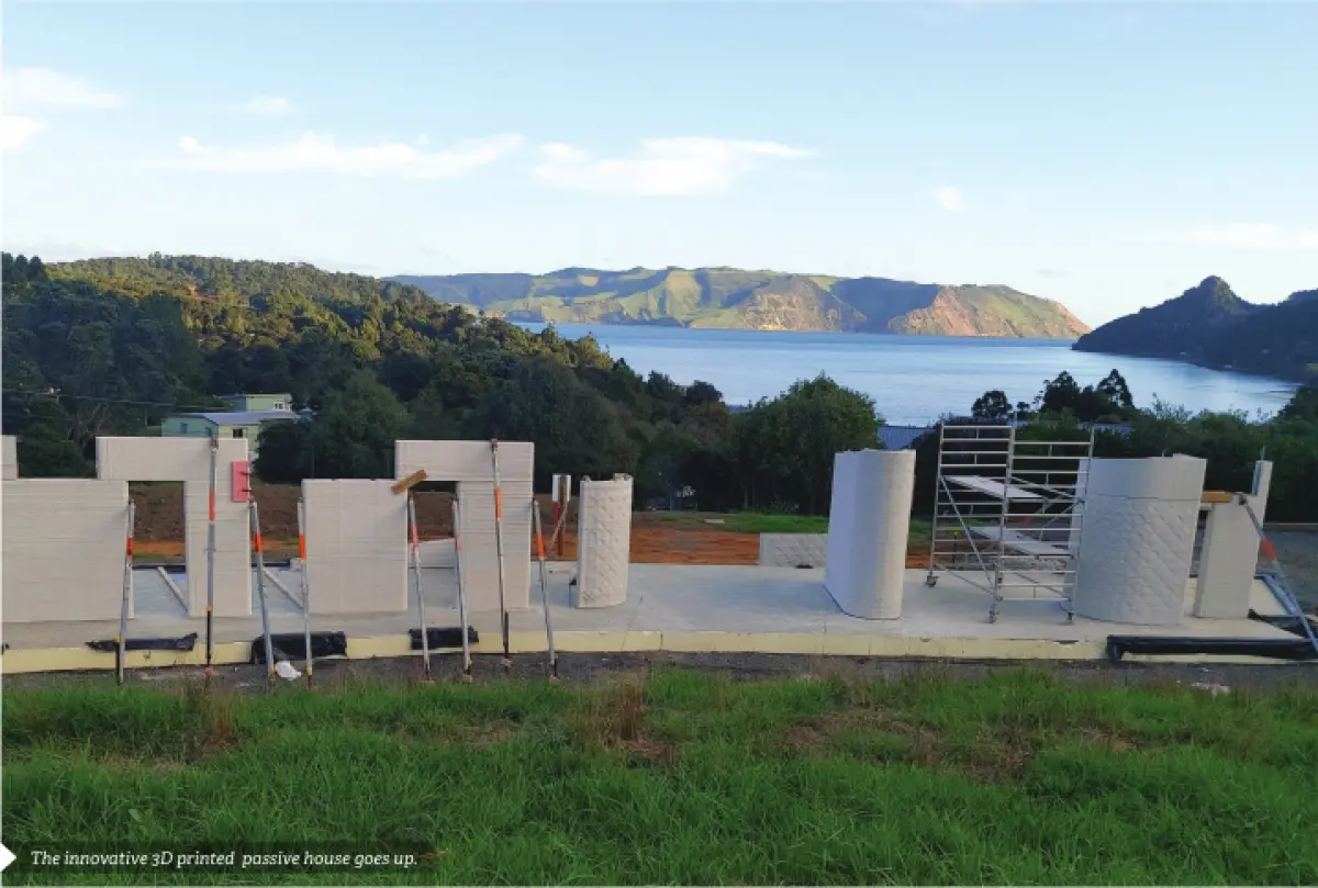 a photo of 3D printed walls overlooking a lake