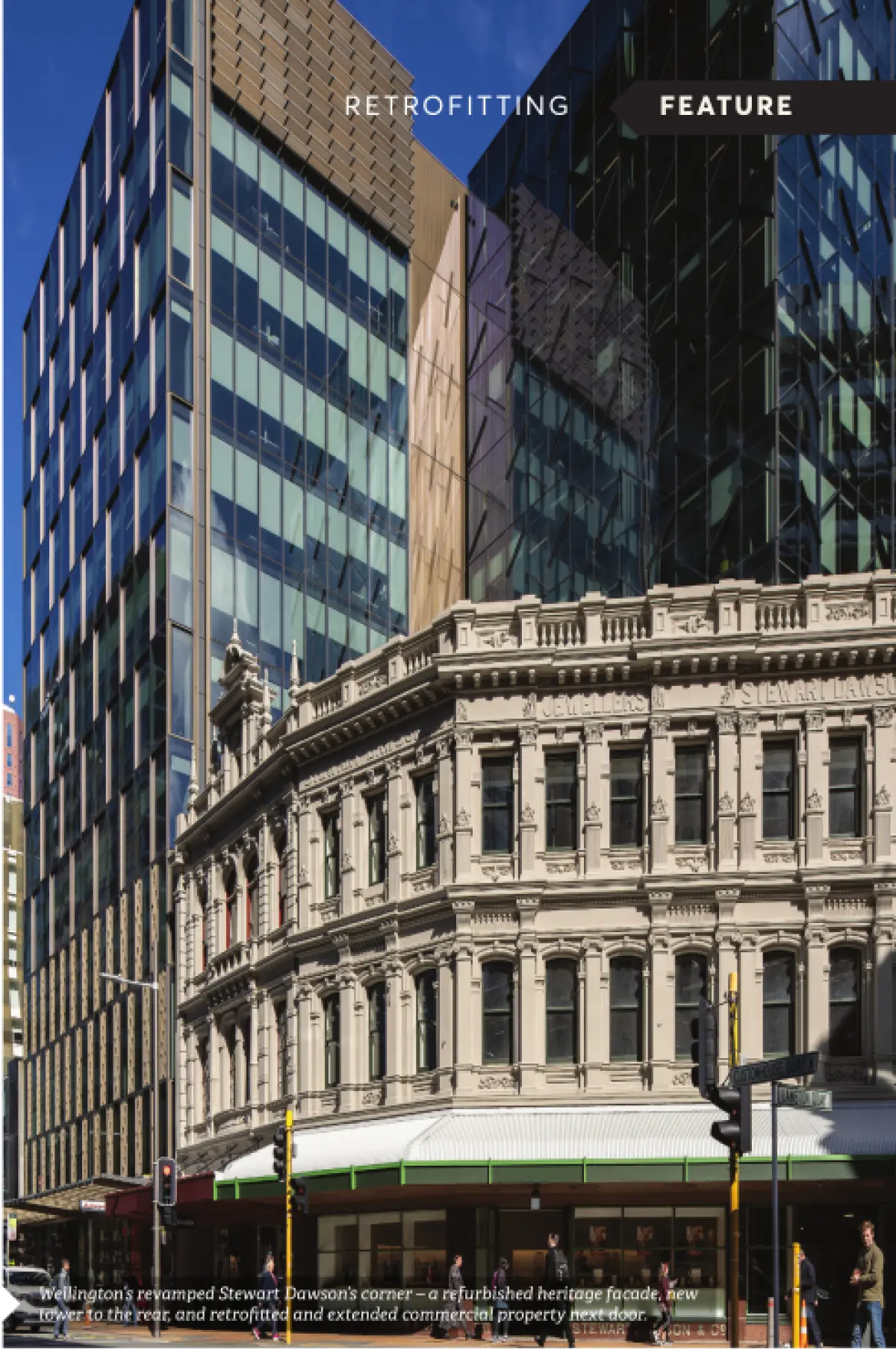 Photograph showing a historic heritage building with a modern glass high‑rise building behind it
