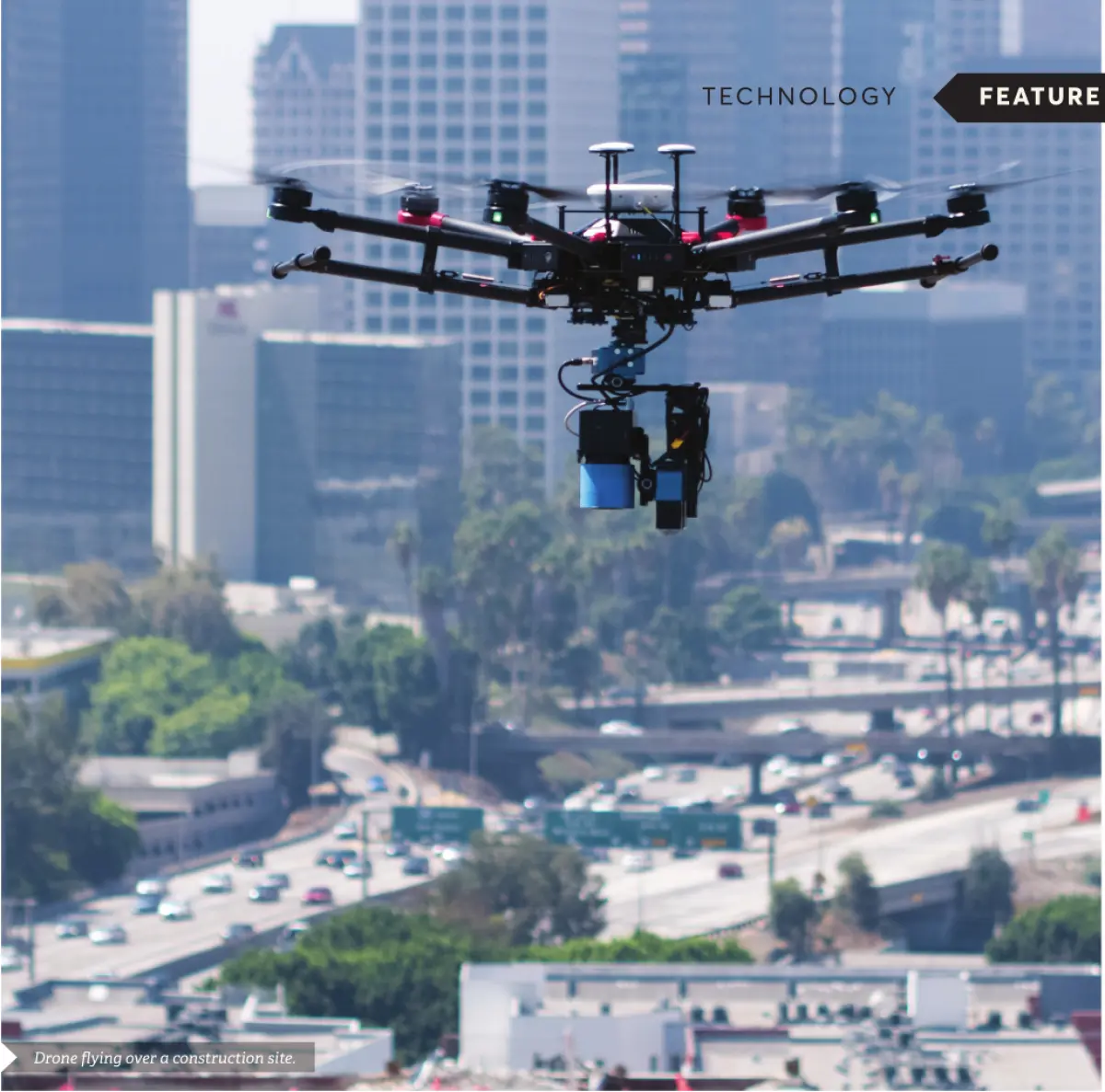 Photograph showing a drone flying above a cityscape