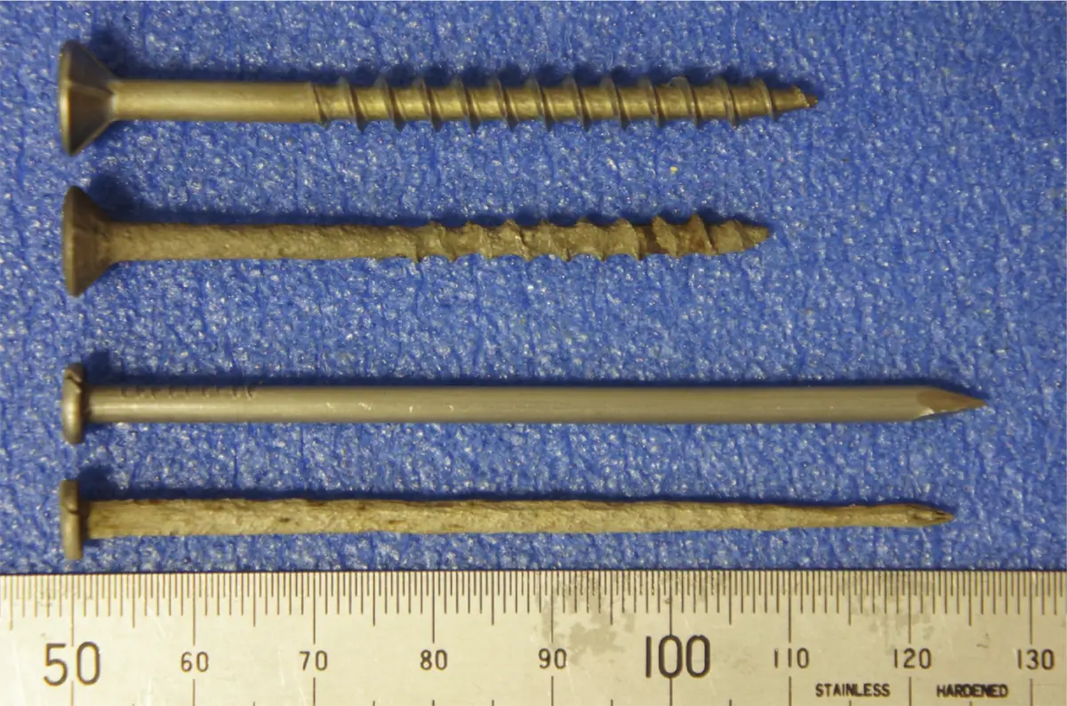 A photo of Corrosion of mild steel nail and screw in untreated timber