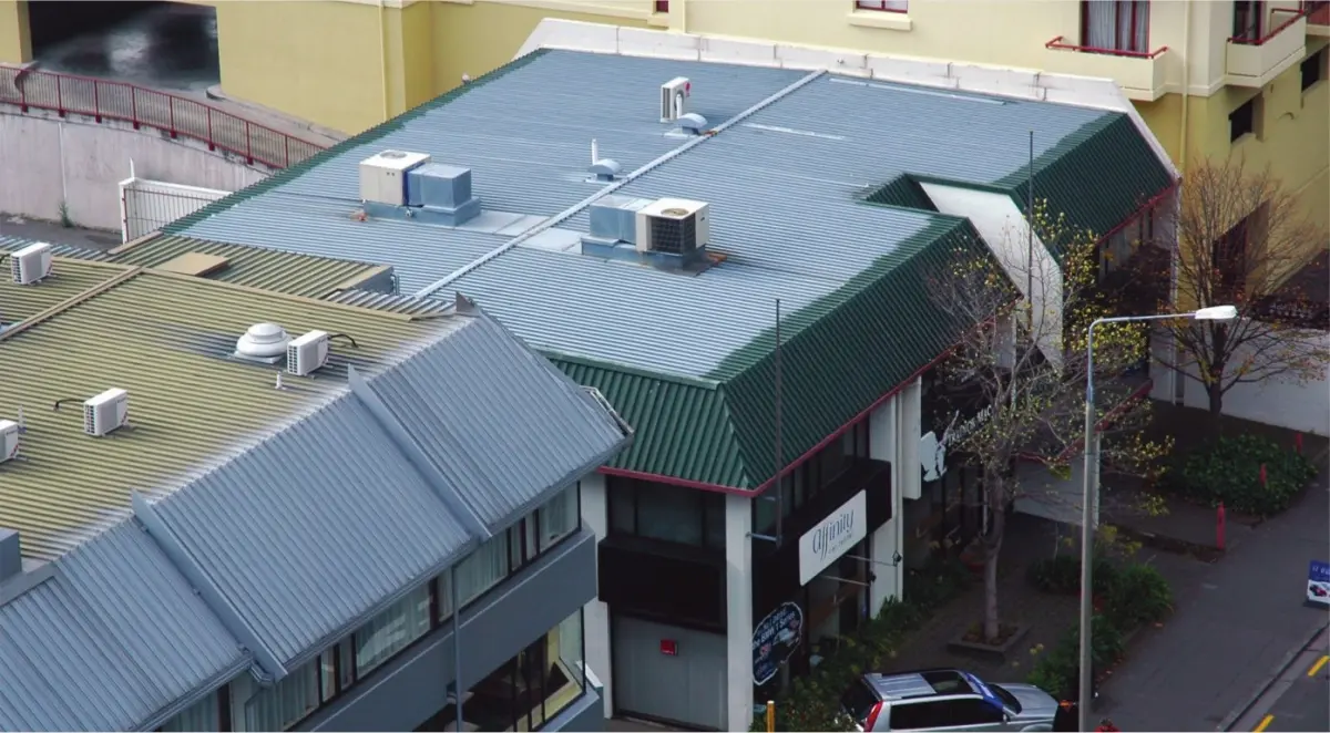 A photo of a building whose roof was only coated on the sides visible from the street