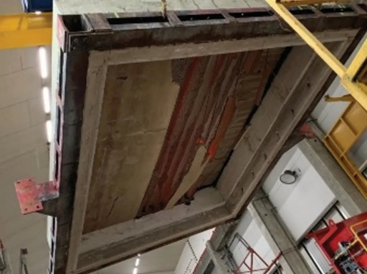 Photograph showing the underside of a concrete floor panel with exposed ribs and finished surface