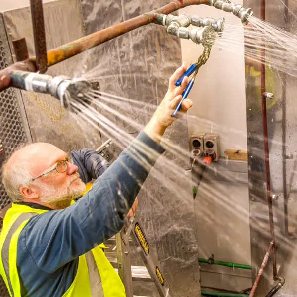 BRANZ researcher in Materials lab simulating the effects of rain and heat on building materials